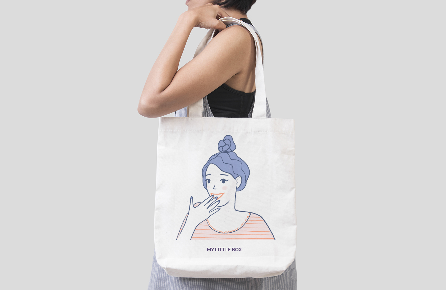 Girl is holding bag canvas fabric for mockup blank template isol
